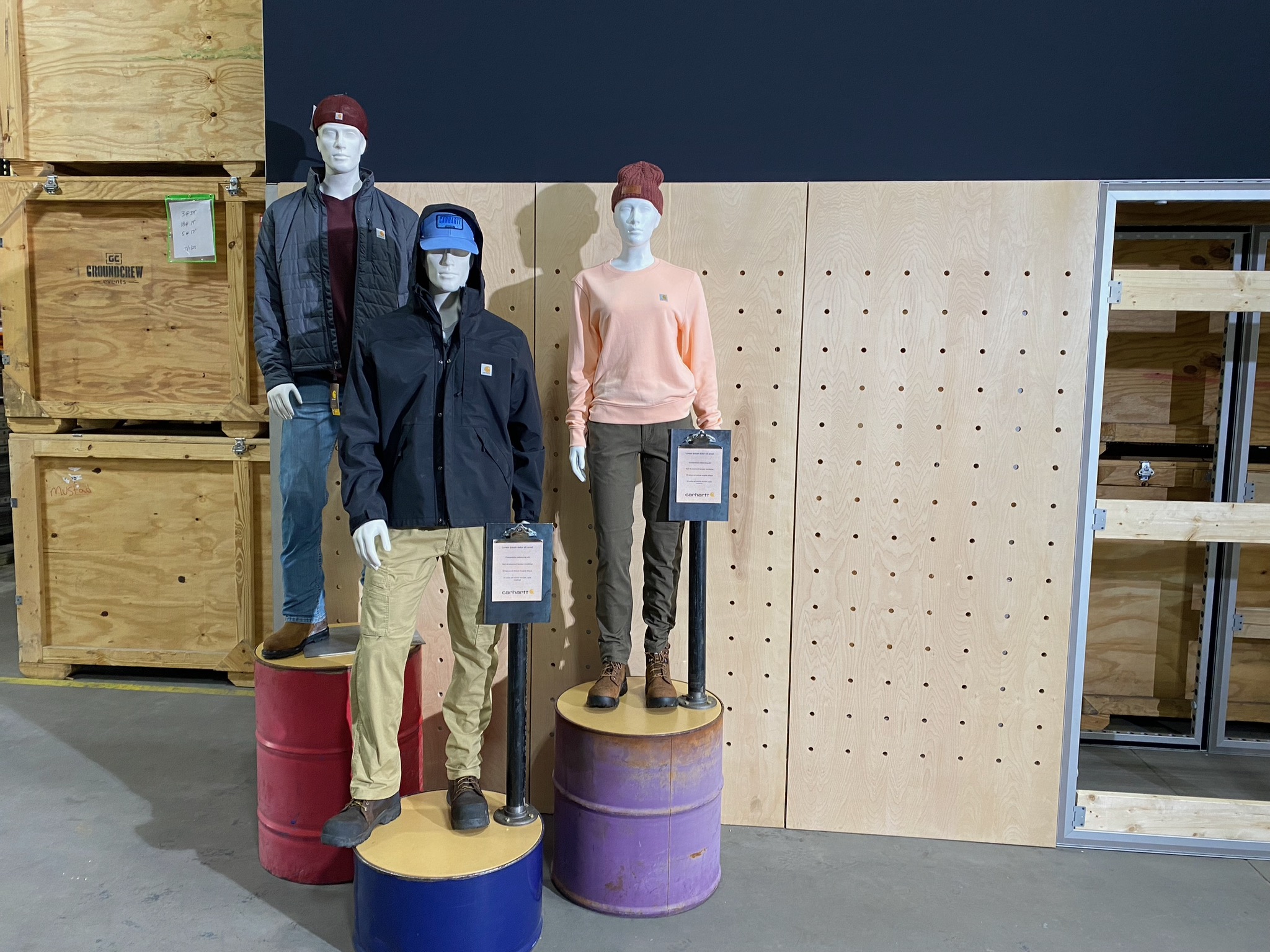 A Carhartt apparel activation displayed on custom barrel pedestals