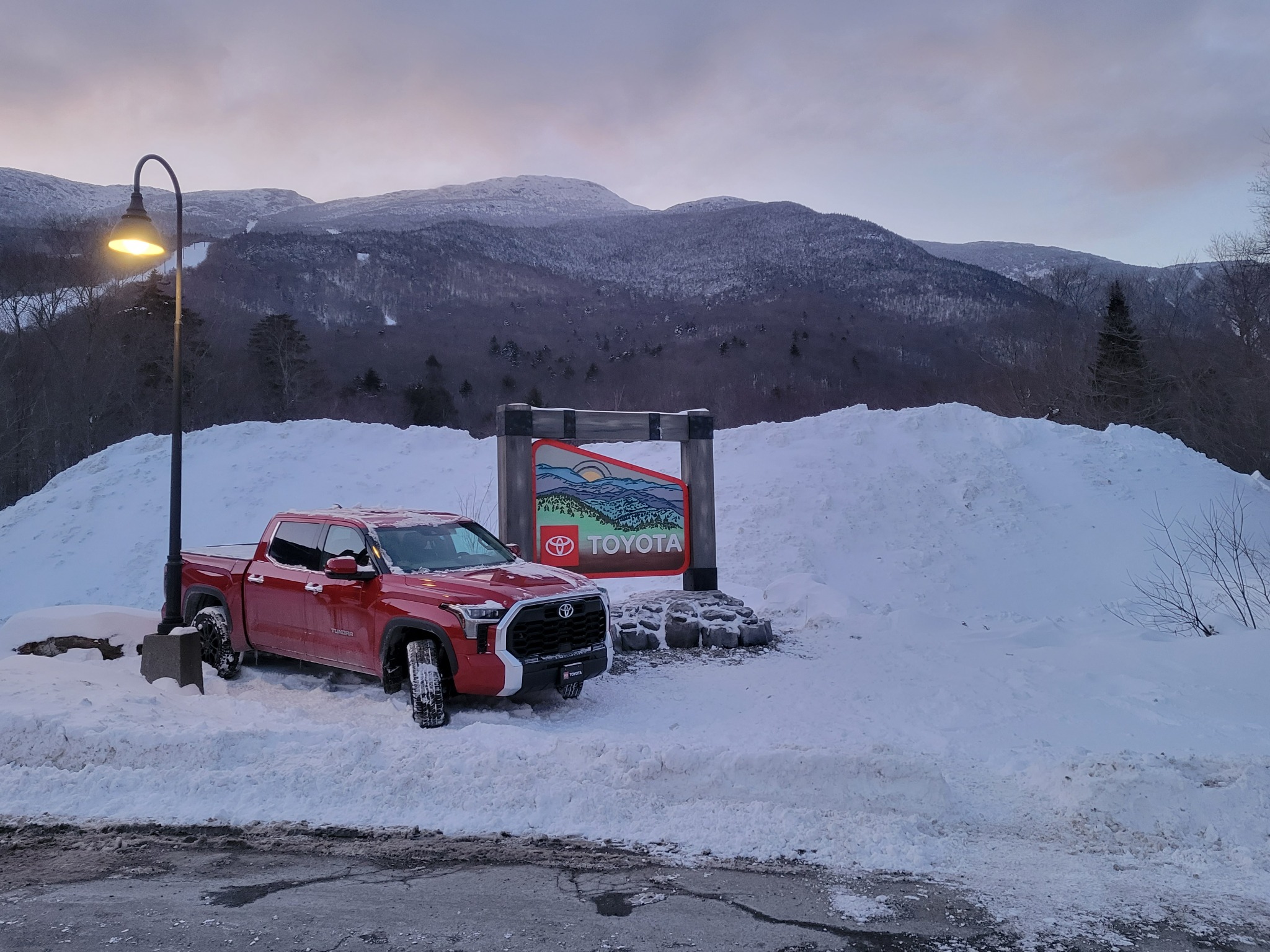 A Toyota truck and branded display installed at a snowy mountain resort
